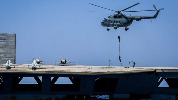 Iranian soldiers jumped on to the mock carrier