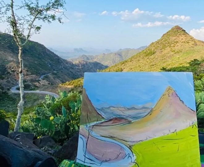 A Nujuum Hashi painting of mountains with the view in the background