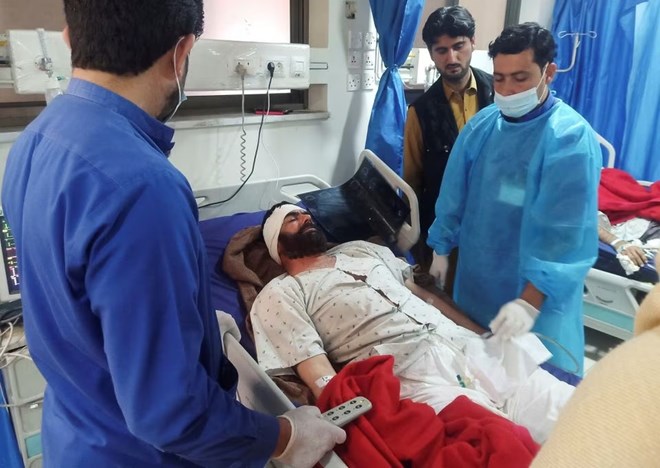 A man, who was injured after a suicide blast in a mosque, receives medical aid at a hospital in Peshawar, Pakistan January 31, 2023. REUTERS/Fayaz Aziz